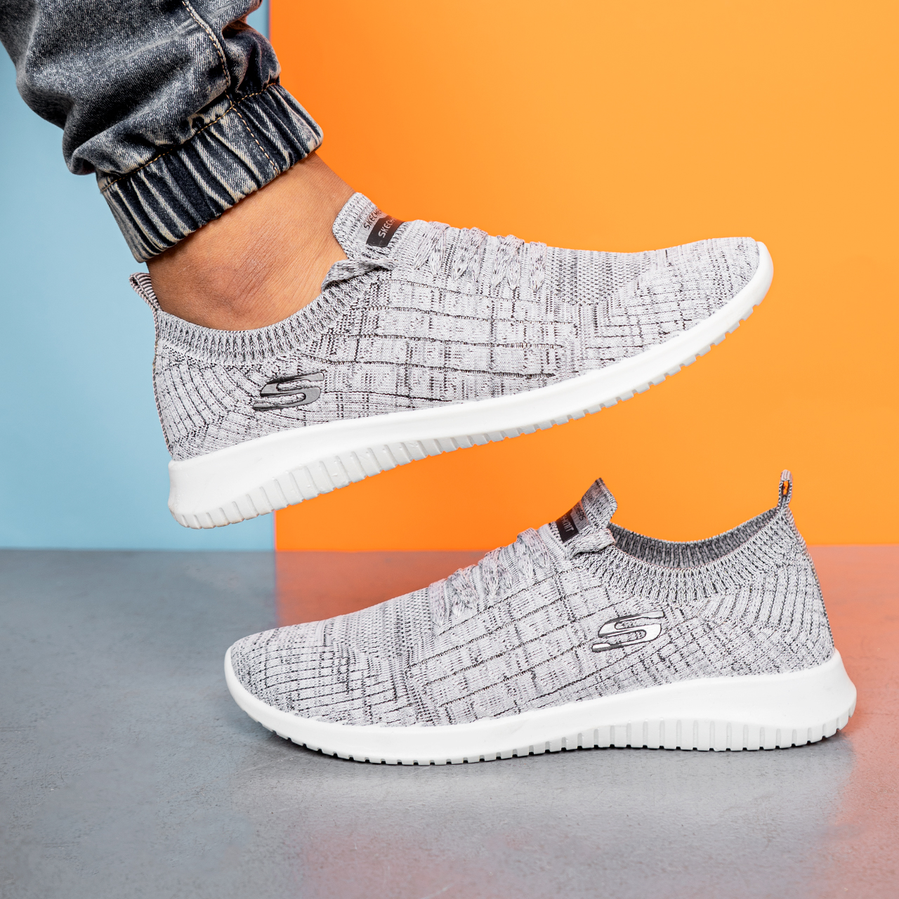 کفش ورزشی اسکیچرز مردانه طوسی طرحدار مدلE55